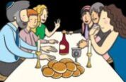 People at table with challah